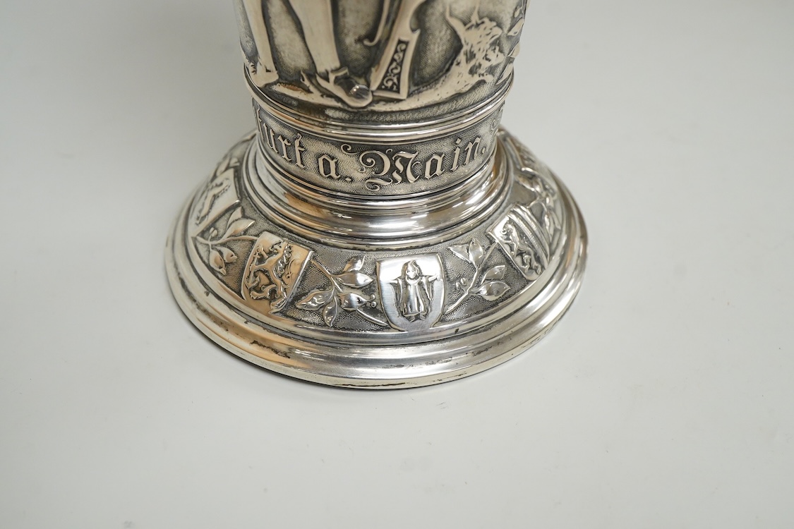 A late 19th century German 800 standard white metal 25th anniversary commemorative vase, embossed with figures, swags and ribbons, 20.9cm, 7.6oz.